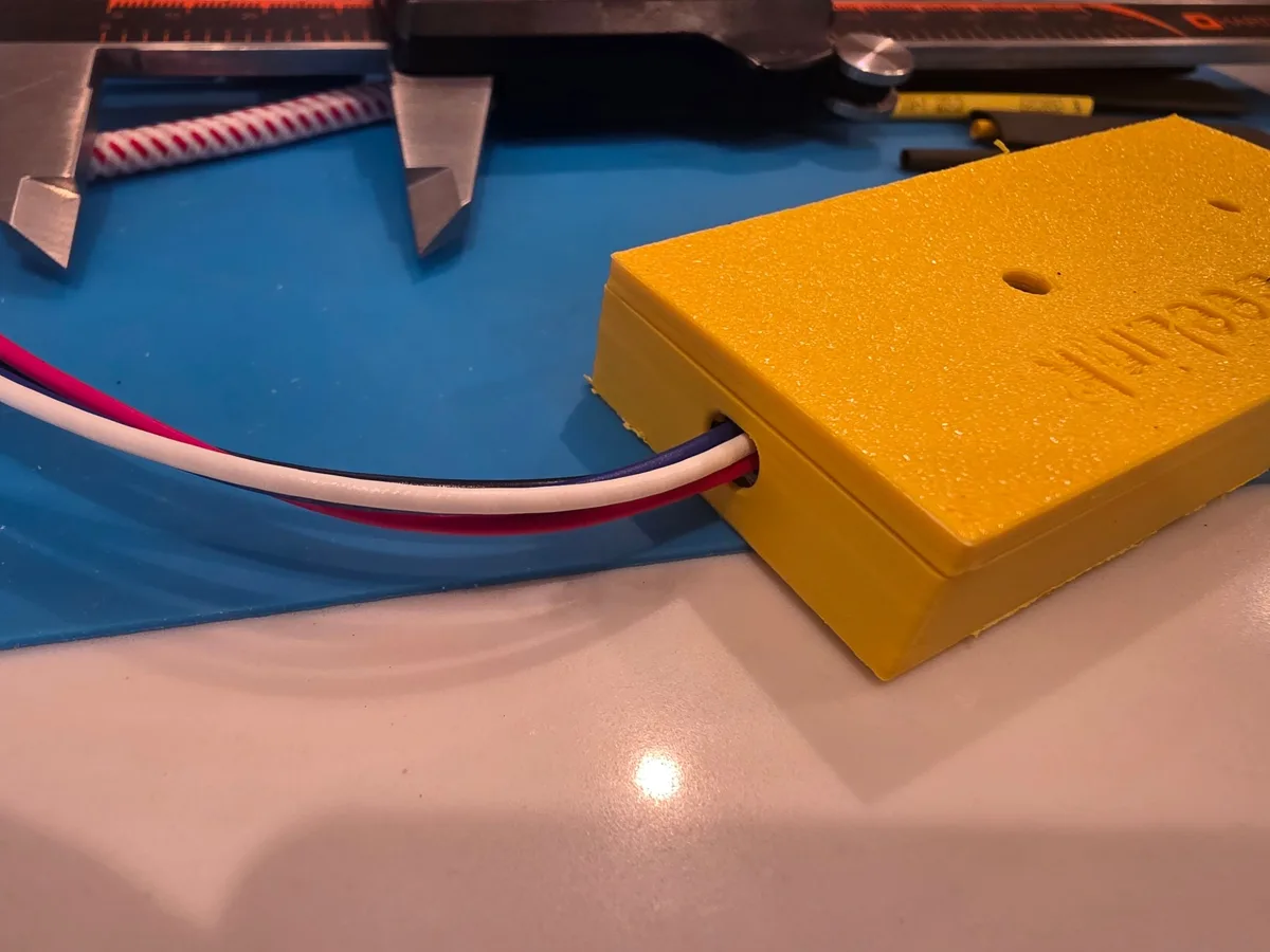 Prototype enclosure with a multi-wire cable leaving the side