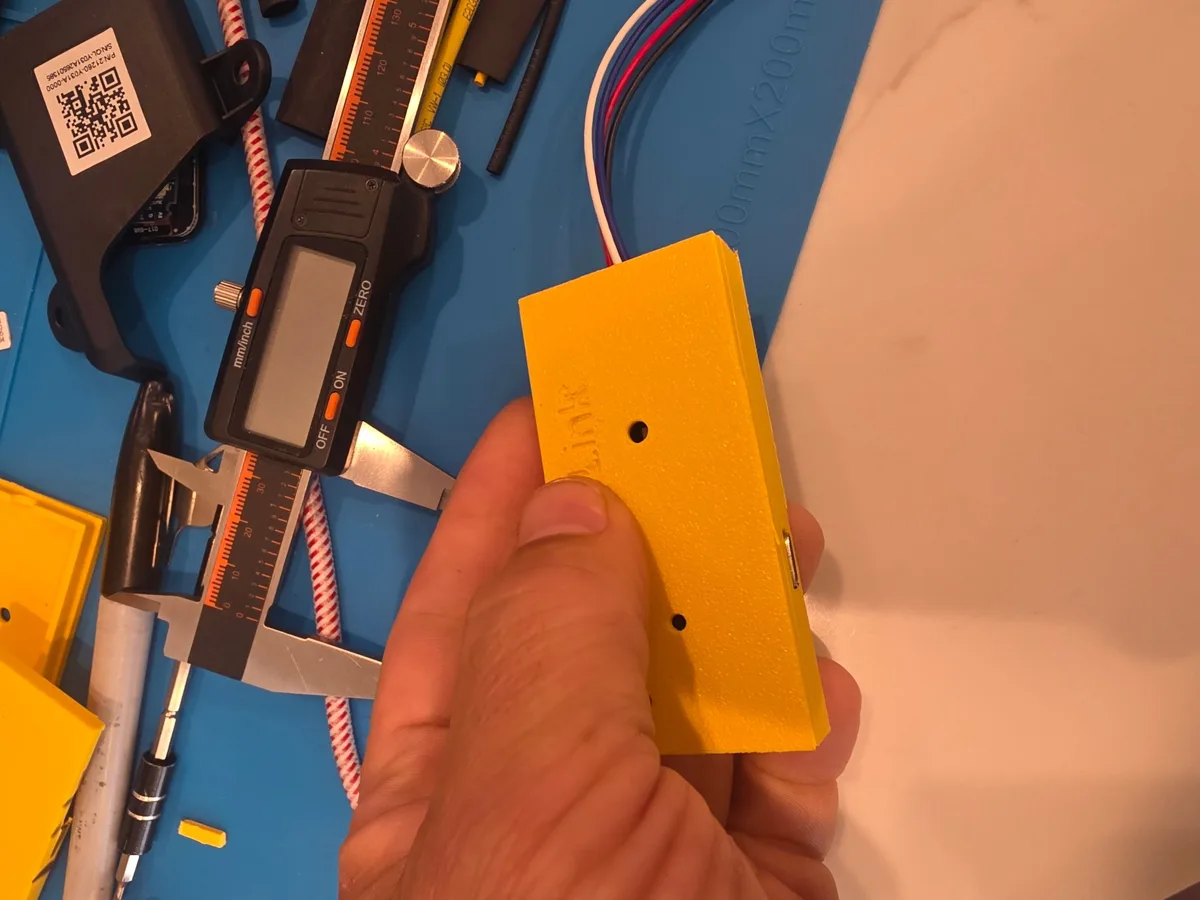 Top of the prototype enclosure with openings and cable leaving the side